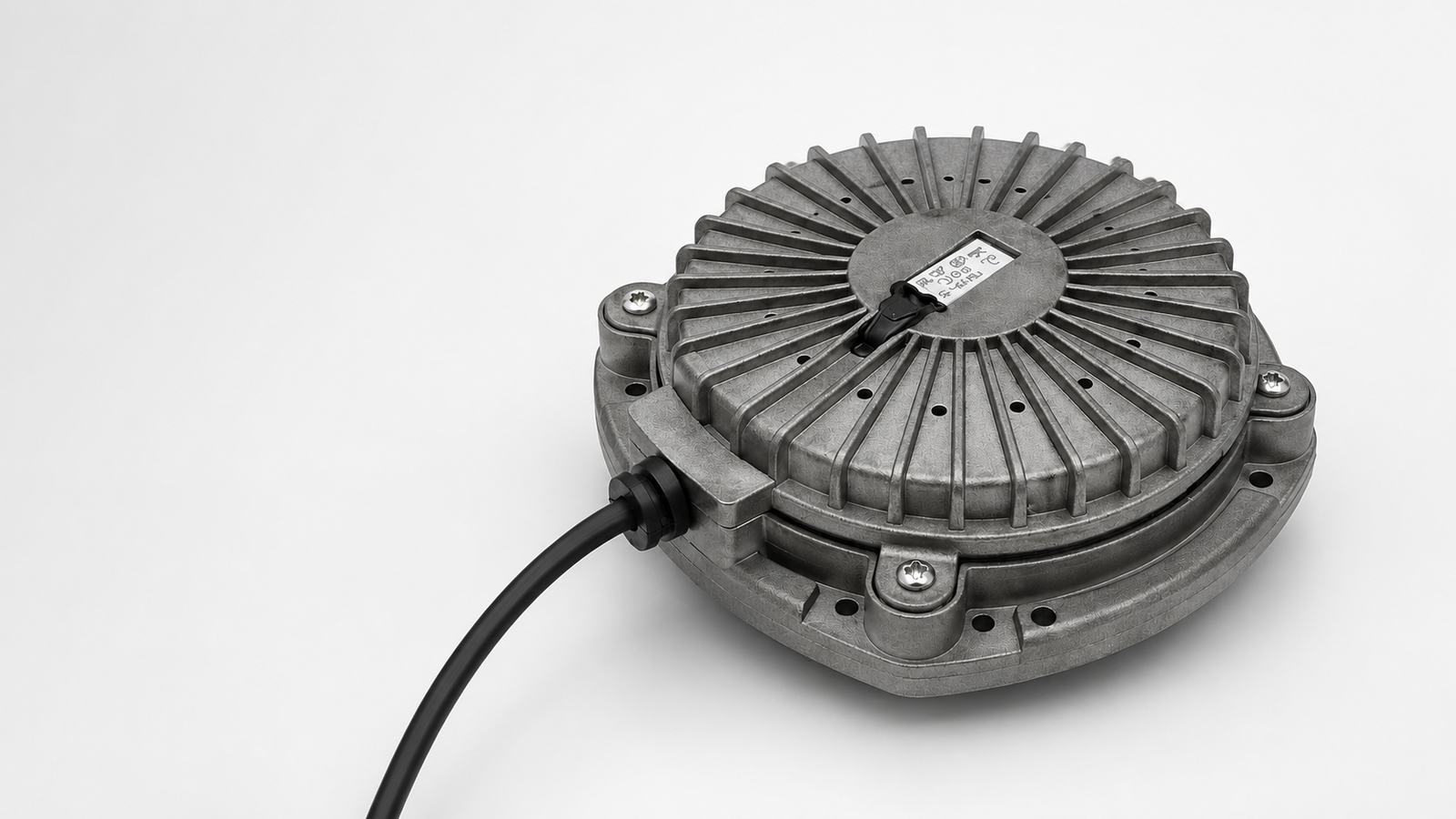 Cast-metal vibration transducer shown at an oblique angle