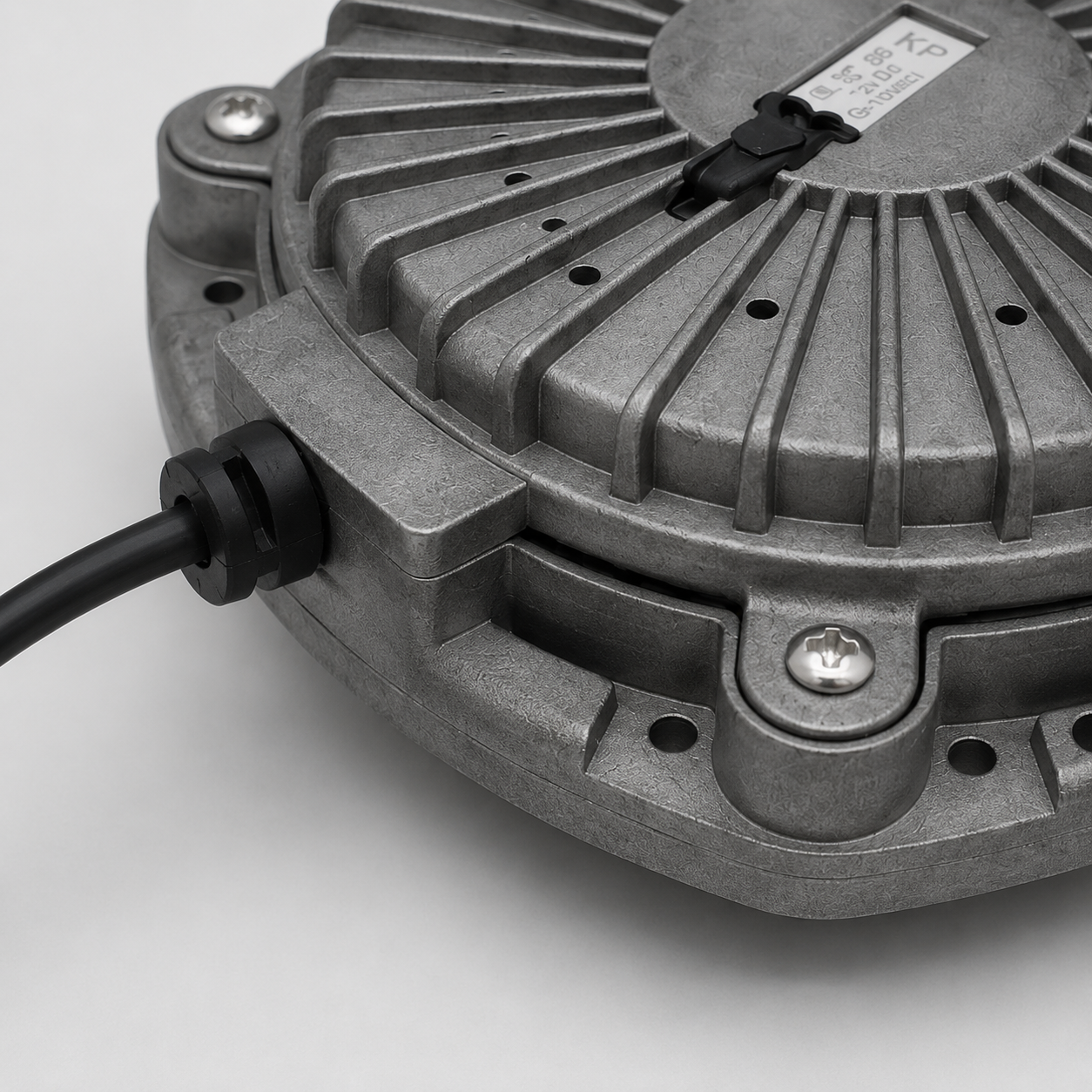 Close-up of the ribbed metal housing, mounting point and cable exit